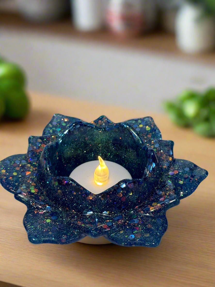 Resin Art Blue Sparkle Votive Candle Holder The candle comes with a votive LED tea light that flickers like a flame.
